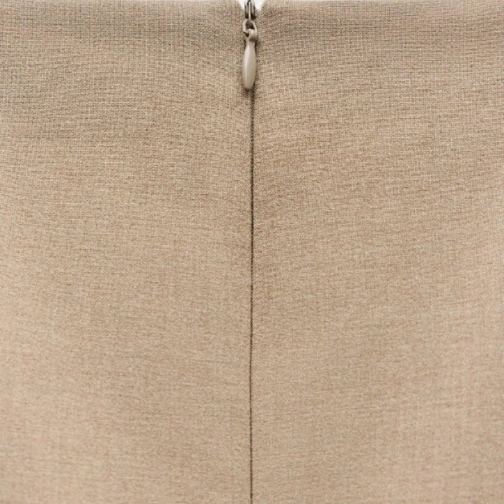Close-up of  Khaki Kouvr fabric with a zipper running vertically.