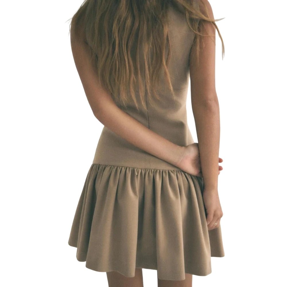 Woman wearing a  Khaki Kouvr dress on a white background