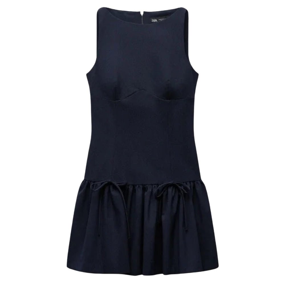Navy Kouvr sleeveless dress with a peplum waist on a white background