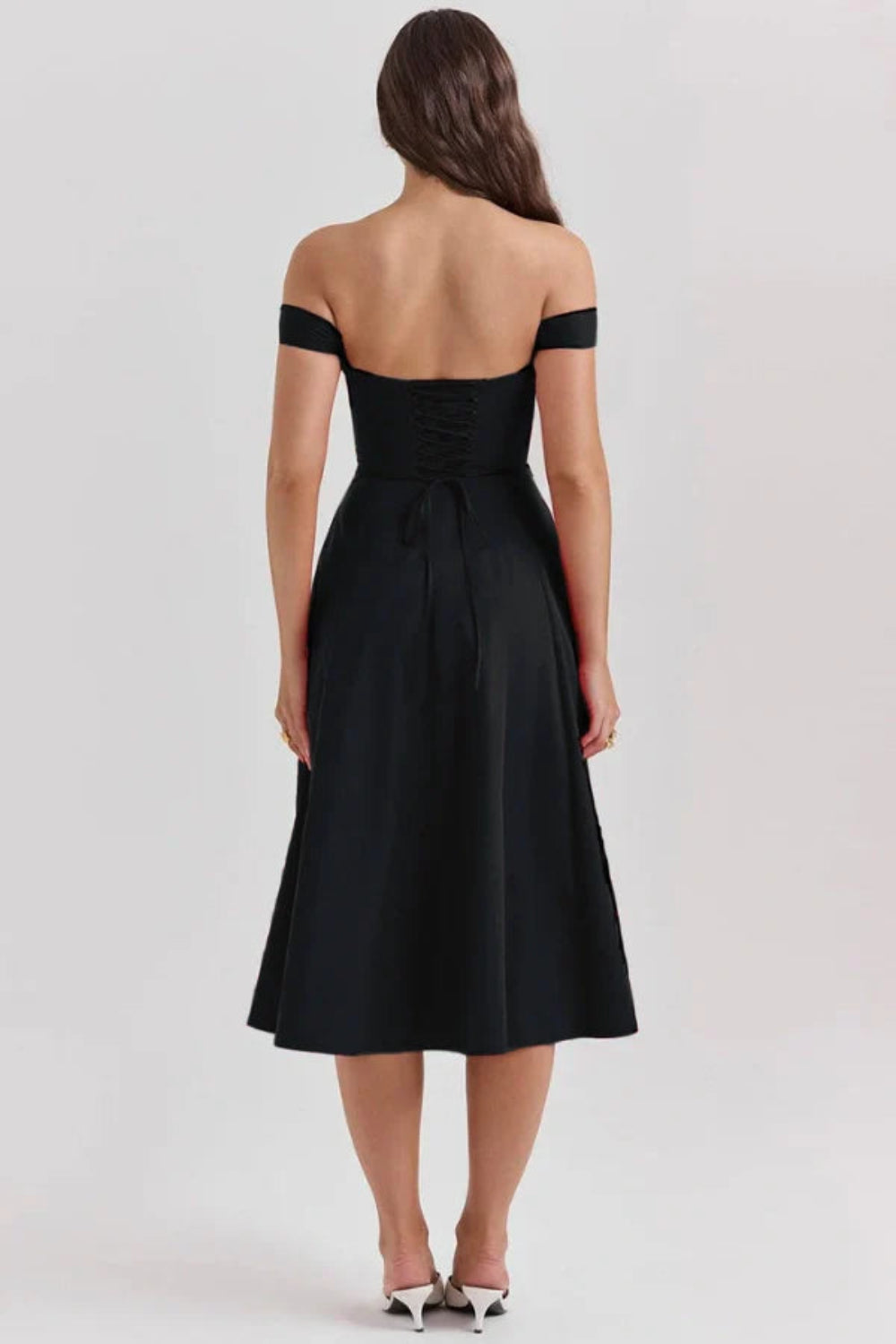 sculpted silhouette', 'cinched waist', 'hourglass figure', 'architectural design', 'timeless elegance', 'sophisticated attire', 'old hollywood glamour', 'investment piece