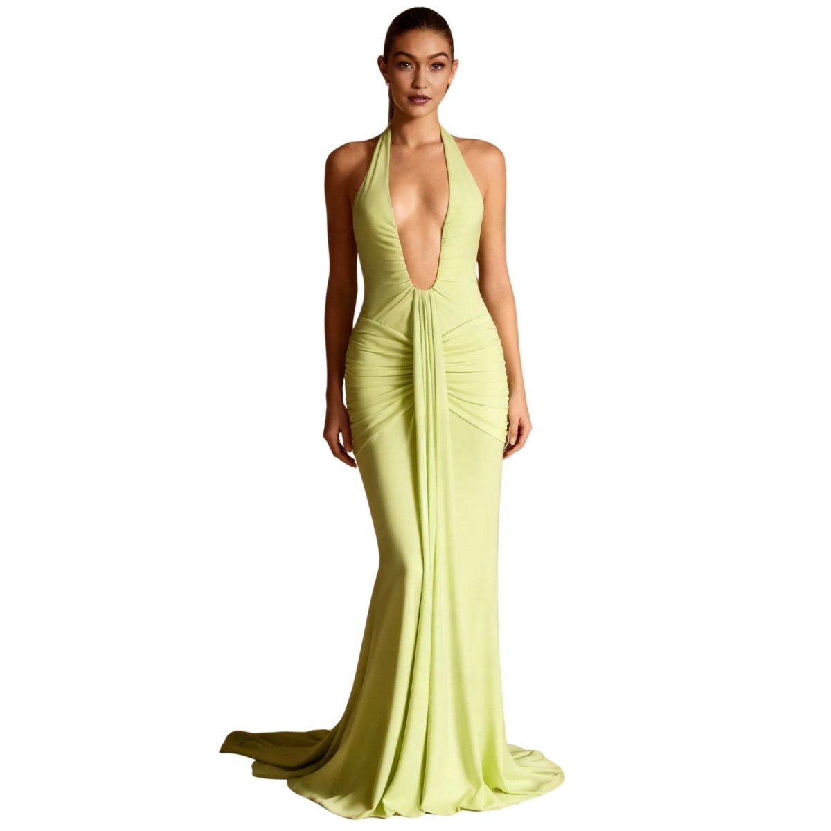Woman wearing a light green Kouvr evening gown on a white background