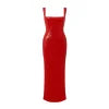 Woman wearing the Kouvr Sezia red sequin gown with an open back in Paris
