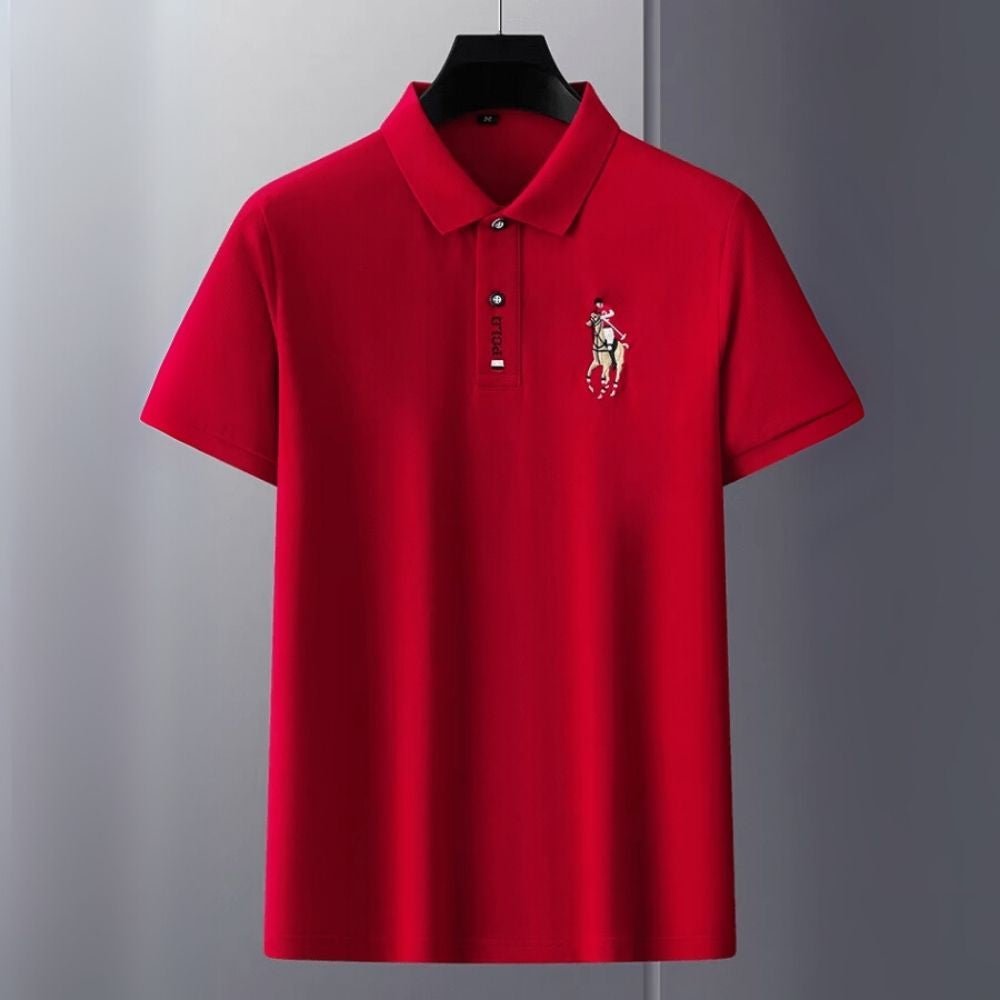 Red kouvr polo shirt with a logo on a gray background