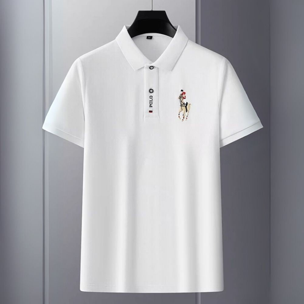 White kouvr polo shirt with a brand logo on a gray background