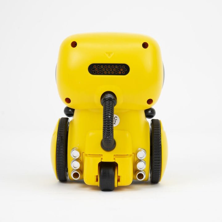 The back view of the yellow Kouvr Groovebot smart robot, showing the third wheel and speaker grill.