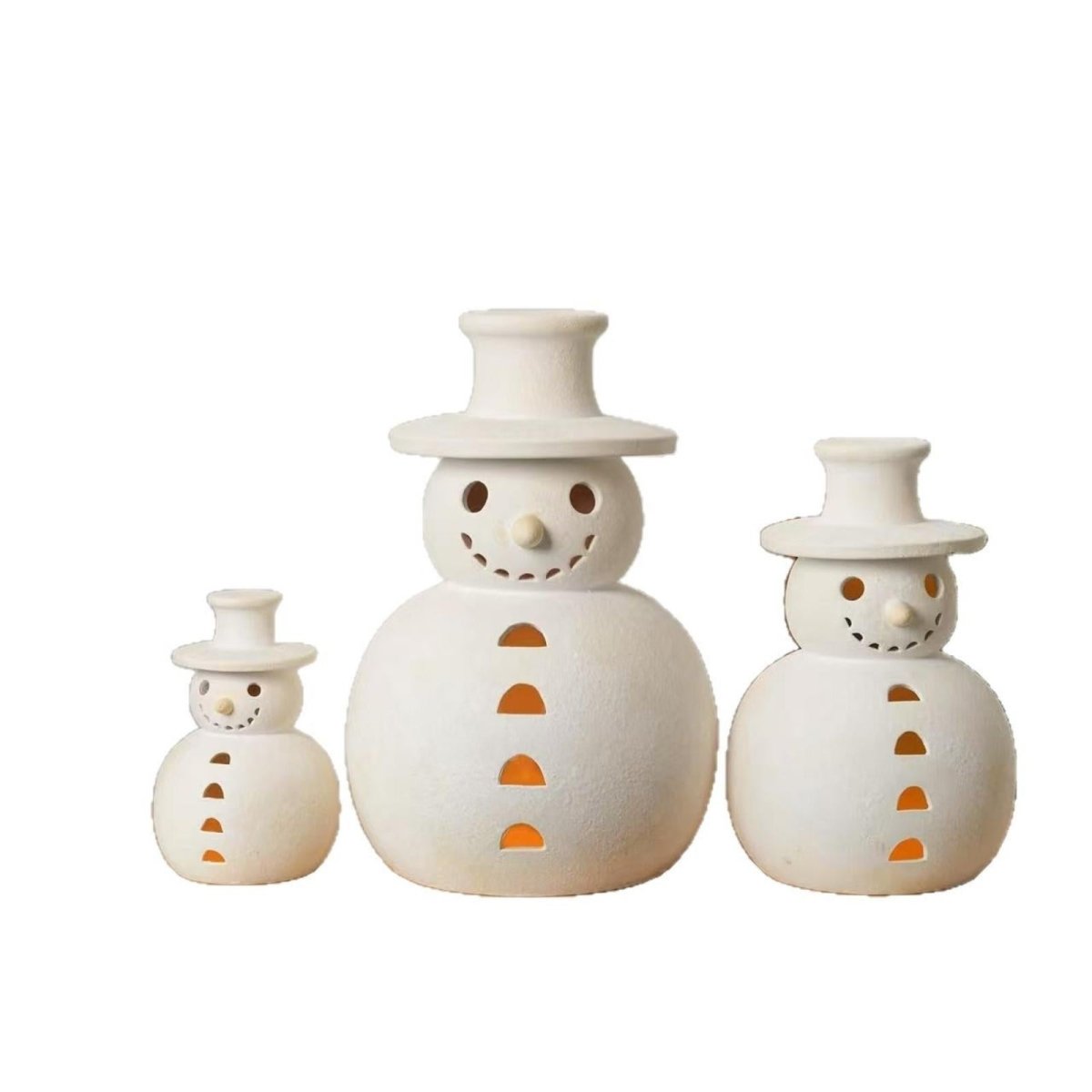 Product shot of a set of three white ceramic snowman luminaries in small, medium, and large sizes, shown on a clean white background.