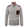 Product-only image of the Kouvr Soren half-zip sweater in heather beige, showing the textured knit, brown suede pocket, and zip detail.
