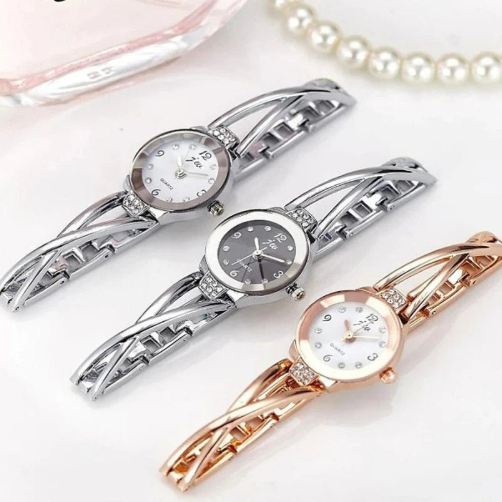 Kouvr SvelteTime women's elegant rose gold bangle watch with crystal accents.
