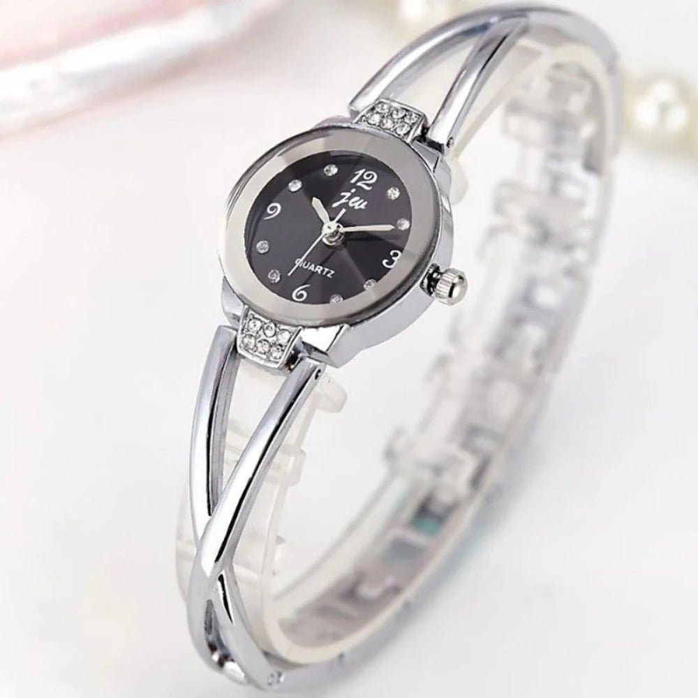 Kouvr SvelteTime women's elegant rose gold bangle watch with crystal accents.