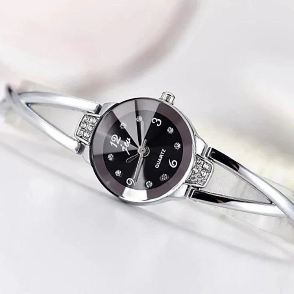 Kouvr SvelteTime women's elegant rose gold bangle watch with crystal accents.
