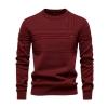 Product-only flat lay image of the front of the Kouvr red textured crewneck sweater, showing detailed knit patterns.  
