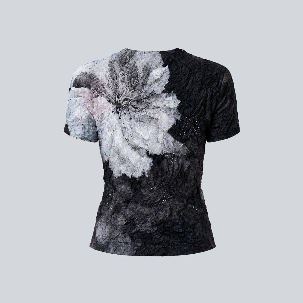 Back flat lay of the Kouvr elevated casual floral top highlighting the highly textured fabric and wrap-around graphic.