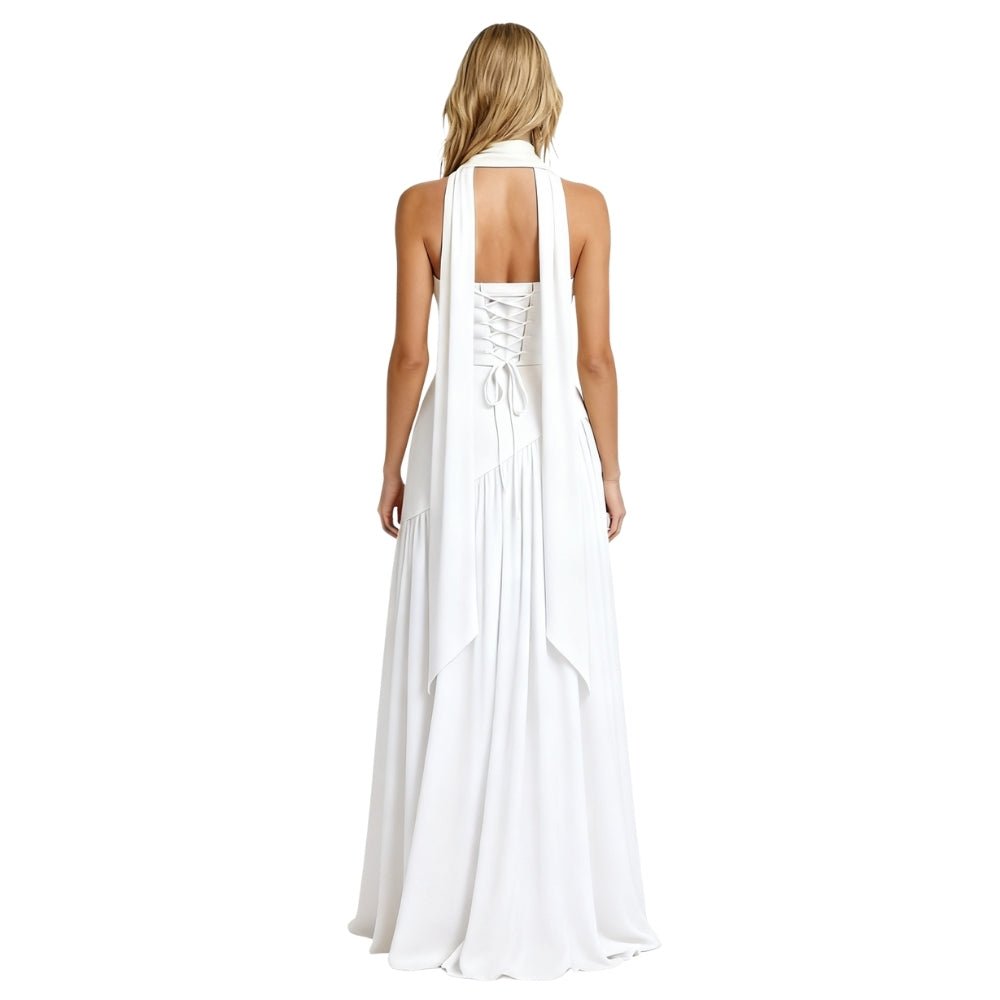 Woman wearing a white Kouvr halter neck dress on a white background