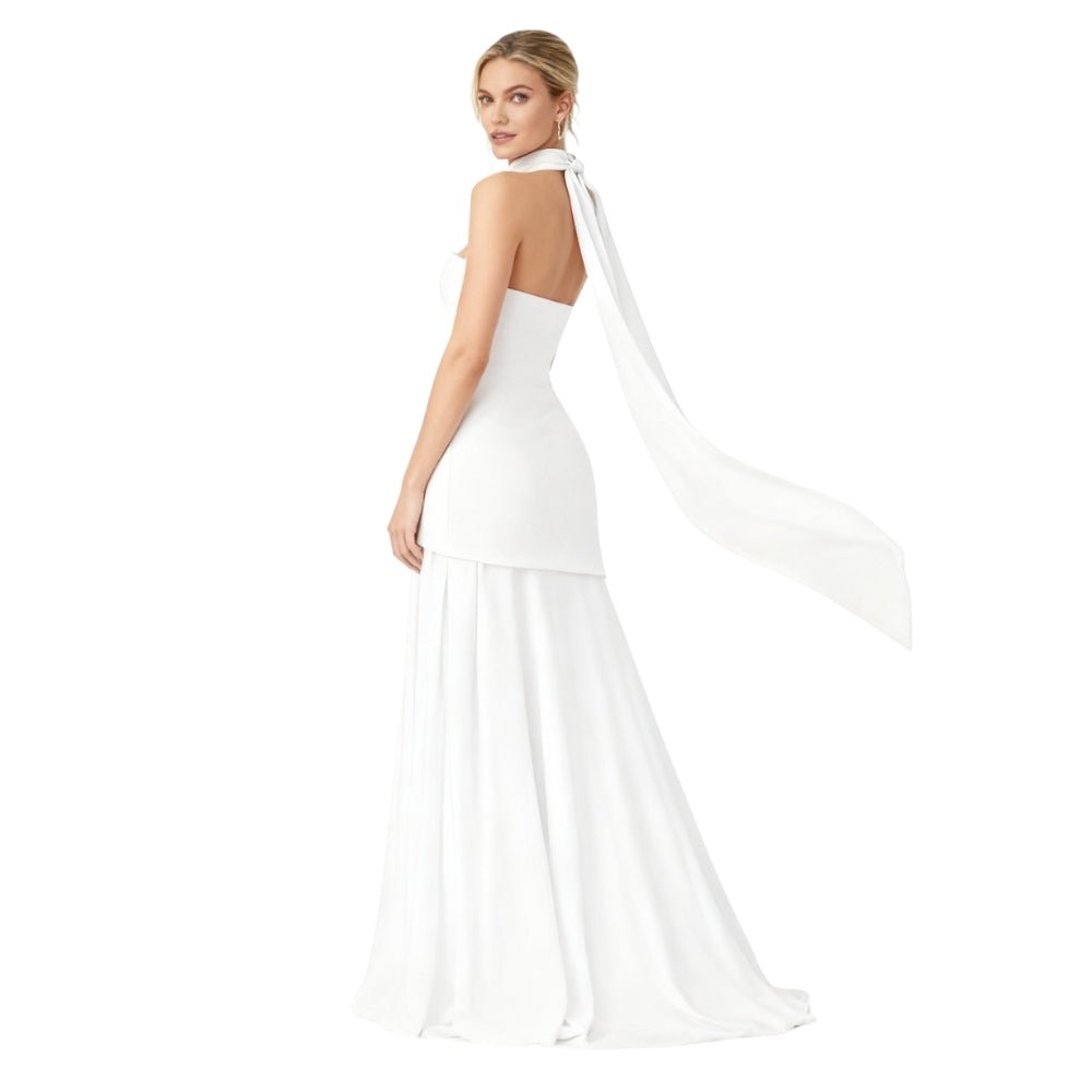 White Kouvr evening gown with a cape on a white background
