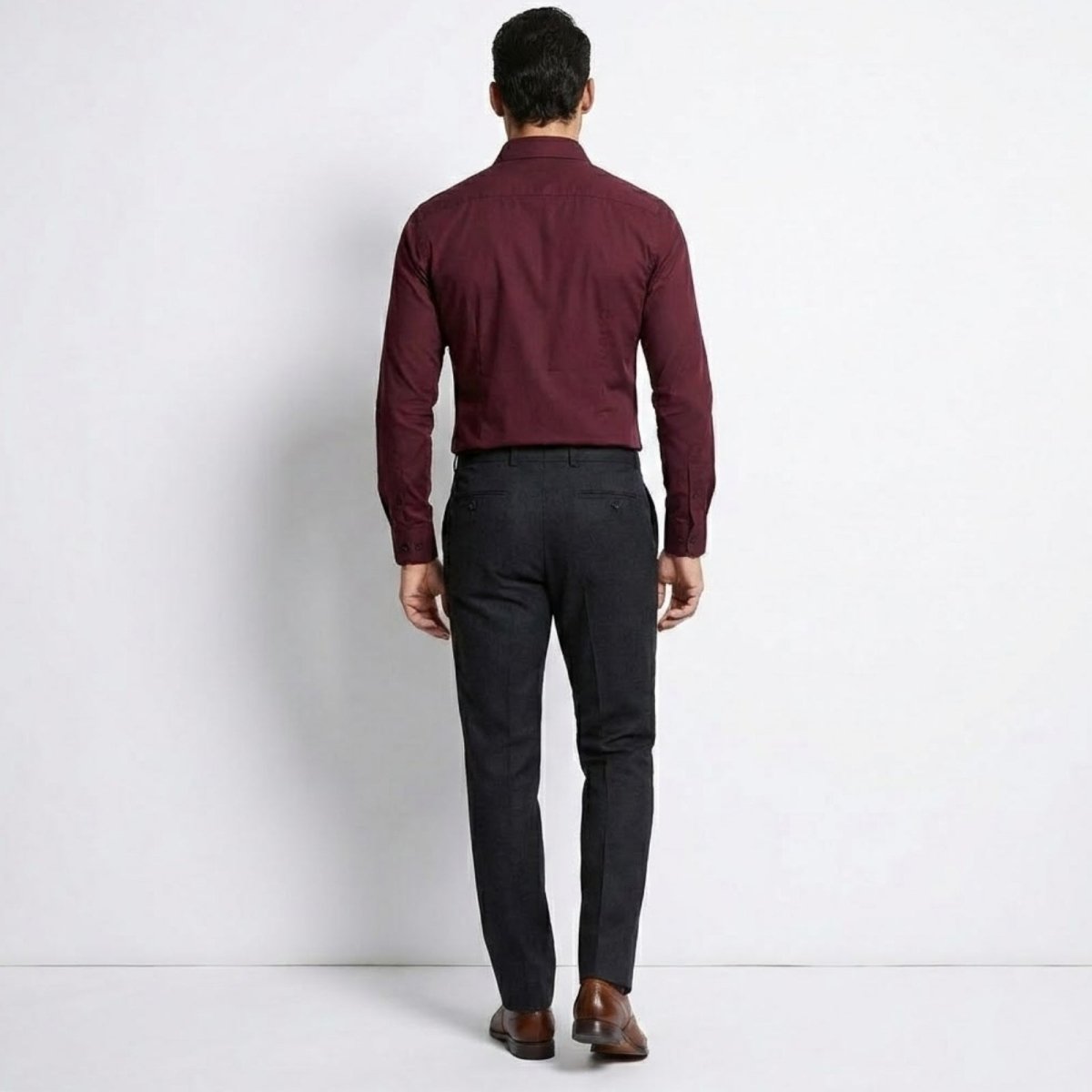 Back view of a man in a Kouvr burgundy smart casual dress shirt highlighting the slim fit and darts.