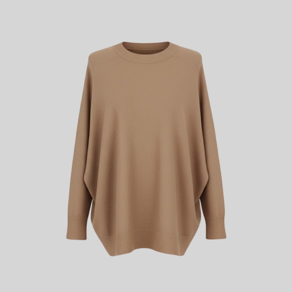 Front flat lay of the Tina oversized cashmere sweater in light brown, highlighting the crewneck and knit texture.
