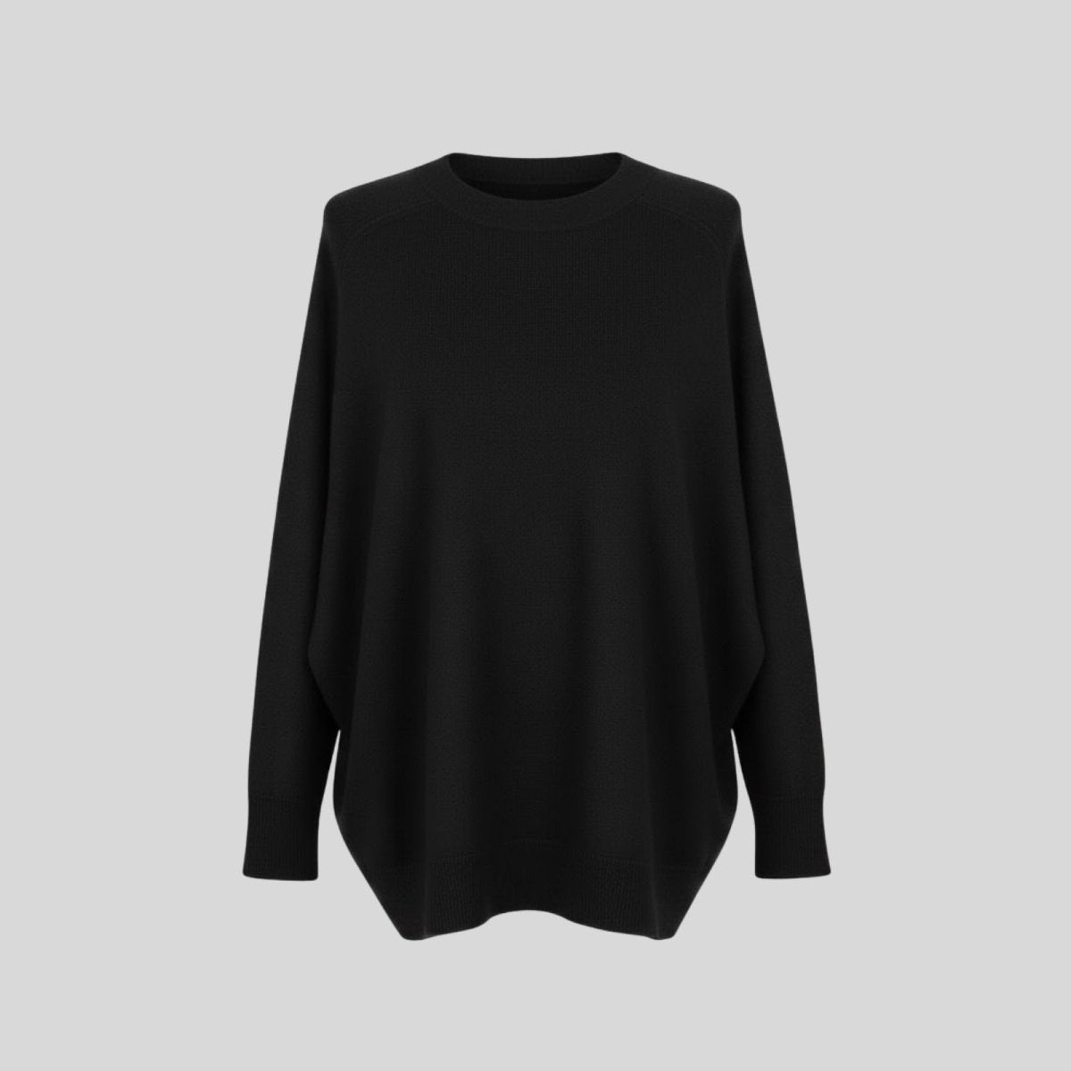 Flatlay of the Kouvr Fashion tina black oversized sweater showing its shape, crewneck, and fine-knit texture.