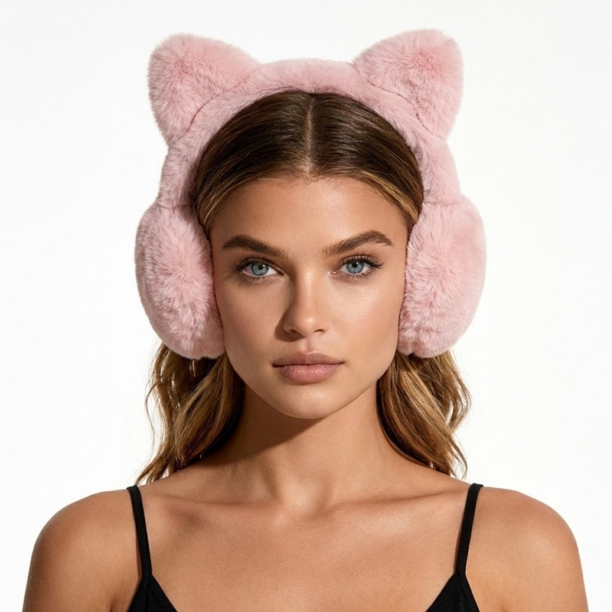 Front view of a model with blue eyes wearing the dusty pink Kouvr Tyra Plush Cat Ear Earmuffs for women.