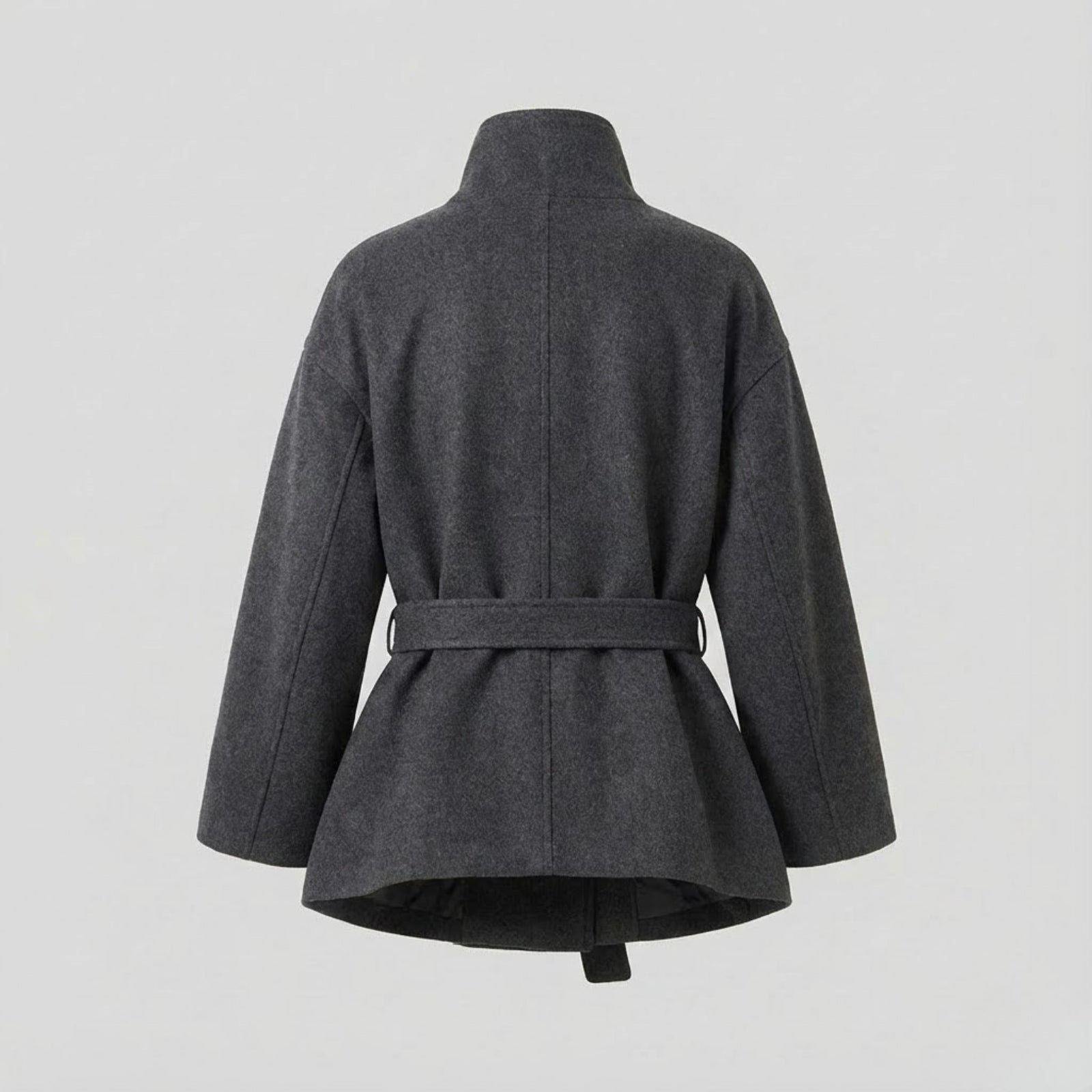 Back flat lay of the Kouvr Verna short wool coat, displaying the construction and belt loop details.