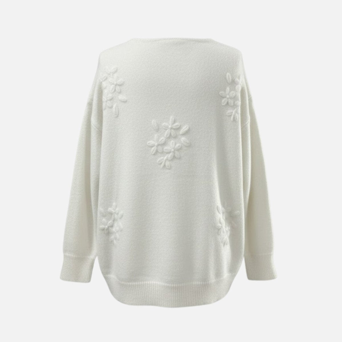 Close-up of the back of the Kouvr white sweater, highlighting the intricate 3D floral embroidery.