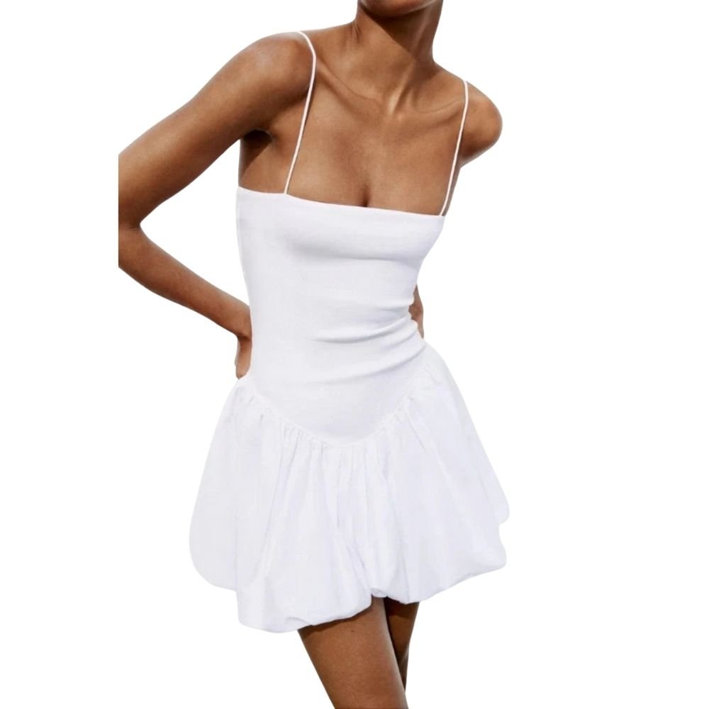 Model wearing the Kouvr white bubble hem mini dress with spaghetti straps