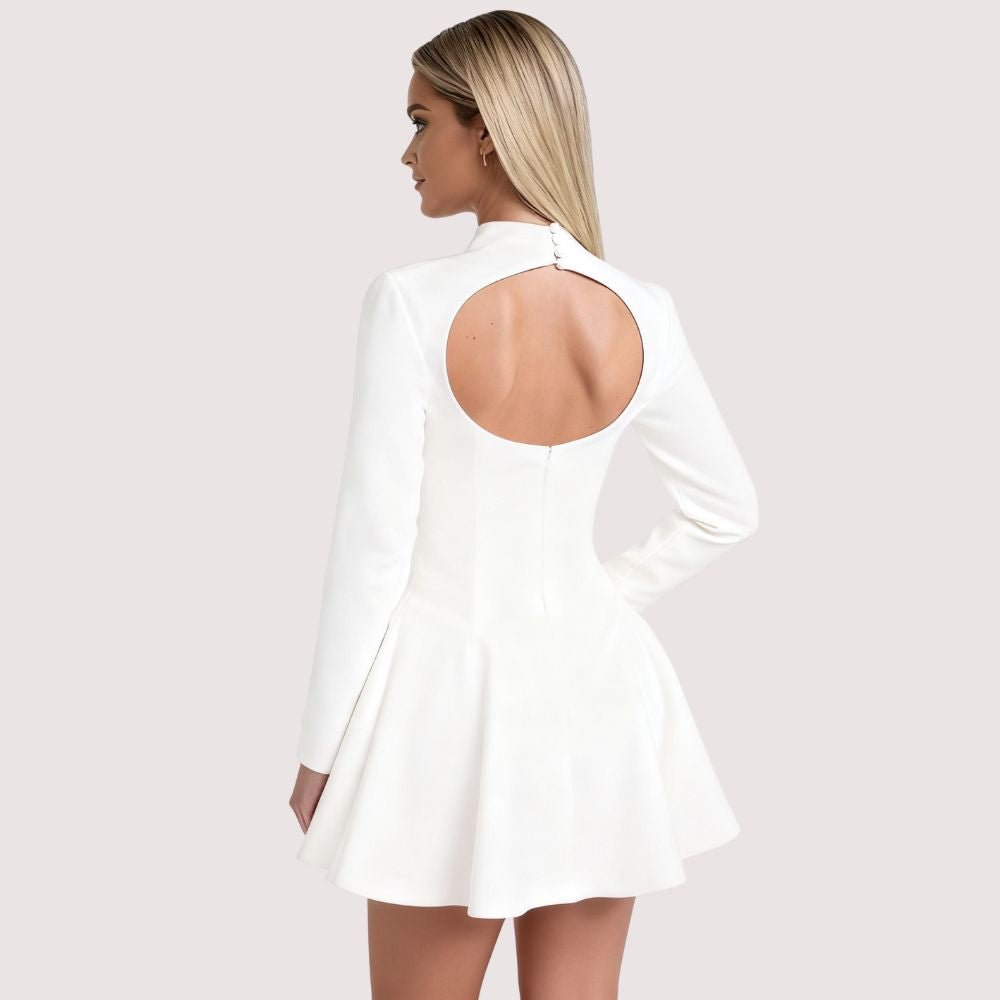 Model wearing Kouvr Fashion white long sleeve mock neck mini dress
