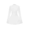 Model wearing Kouvr Fashion white long sleeve mock neck mini dress