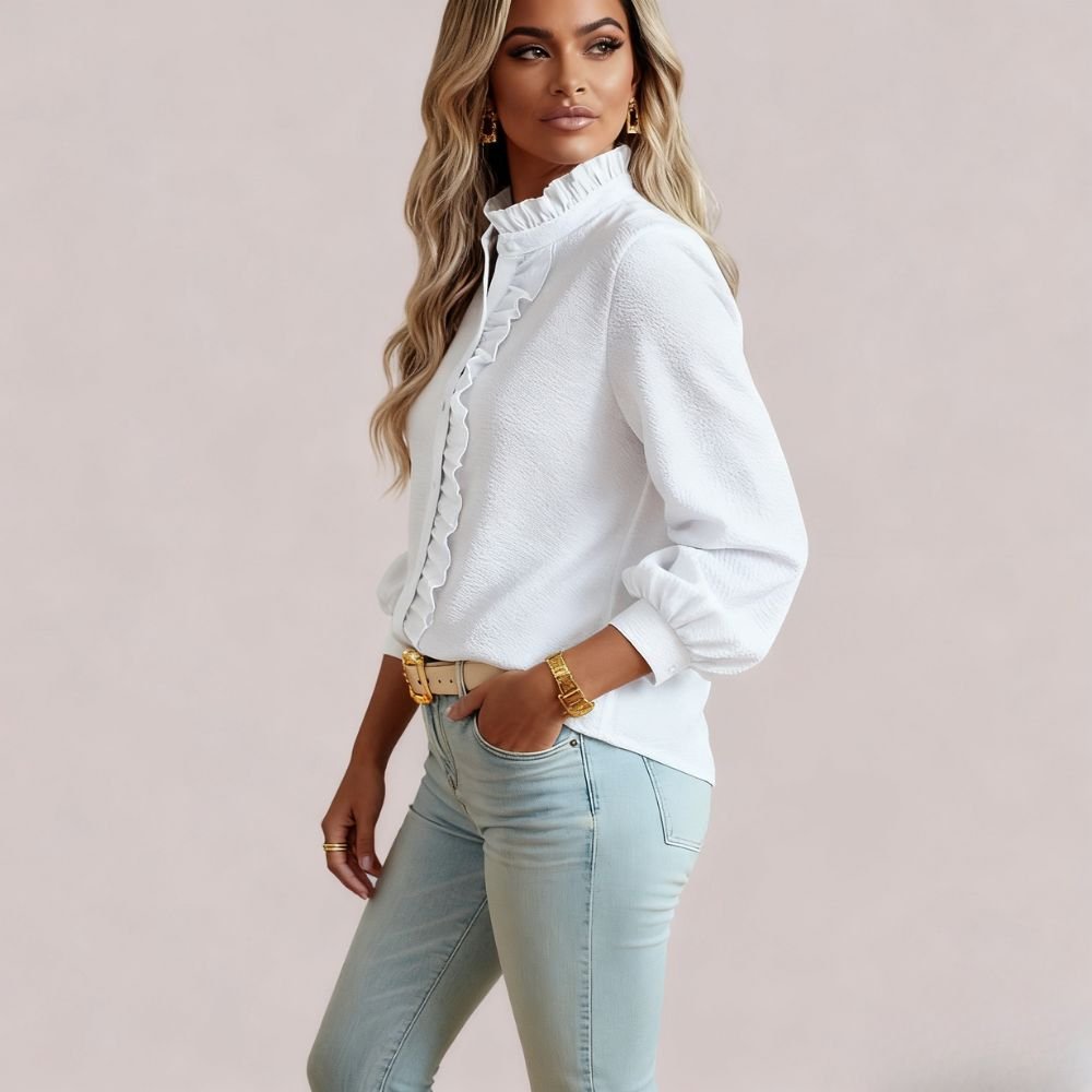 Model wearing the Kouvr women's white textured blouse with ruffle collar, paired with light wash jeans