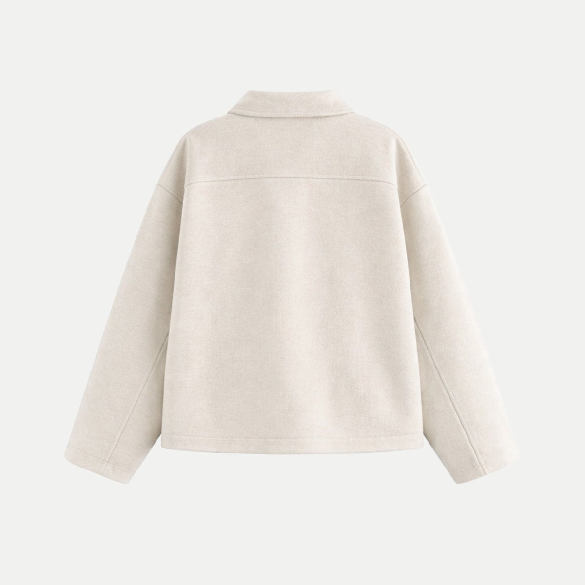 Studio flat lay back view of the Kouvr minimalist white jacket detailing the clean lines and oversized silhouette