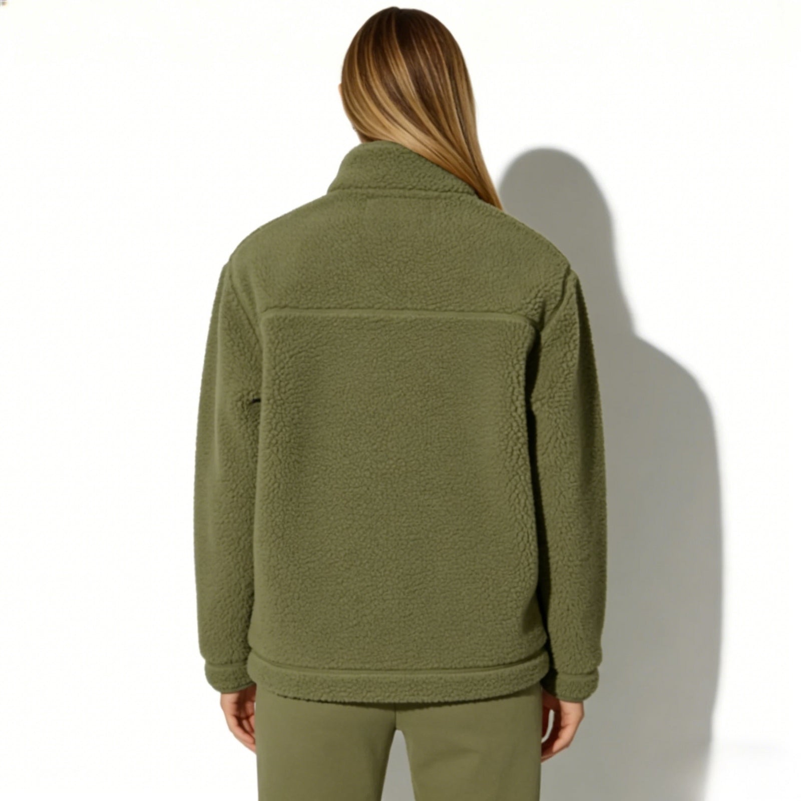 Back view of the Kouvr women's army green sherpa fleece jacket highlighting the yoke detail.