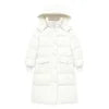 Woman wearing the Kouvr CloudWalker oversized long puffer coat in winter white