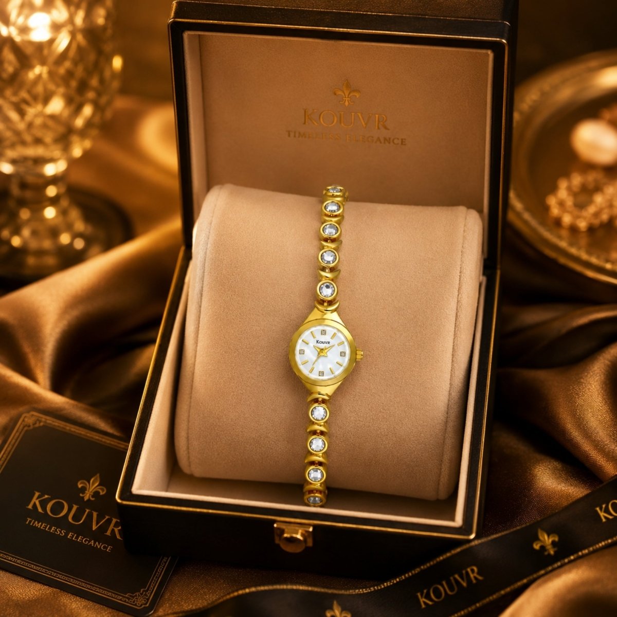 Kouvr elegant women's gold crystal bracelet watch resting in a luxury suede-lined presentation box.