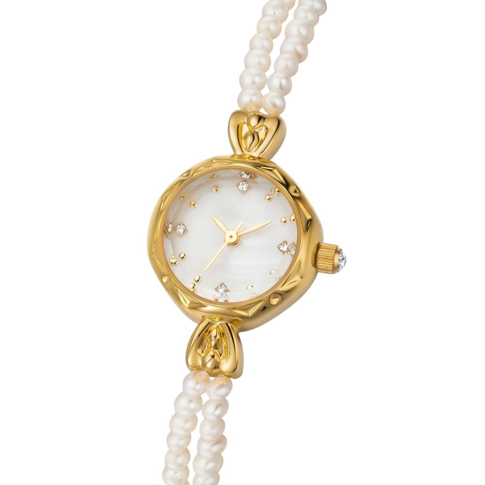Kouvr women's elegant gold watch with a double strand real pearl bracelet and mother of pearl dial on wrist