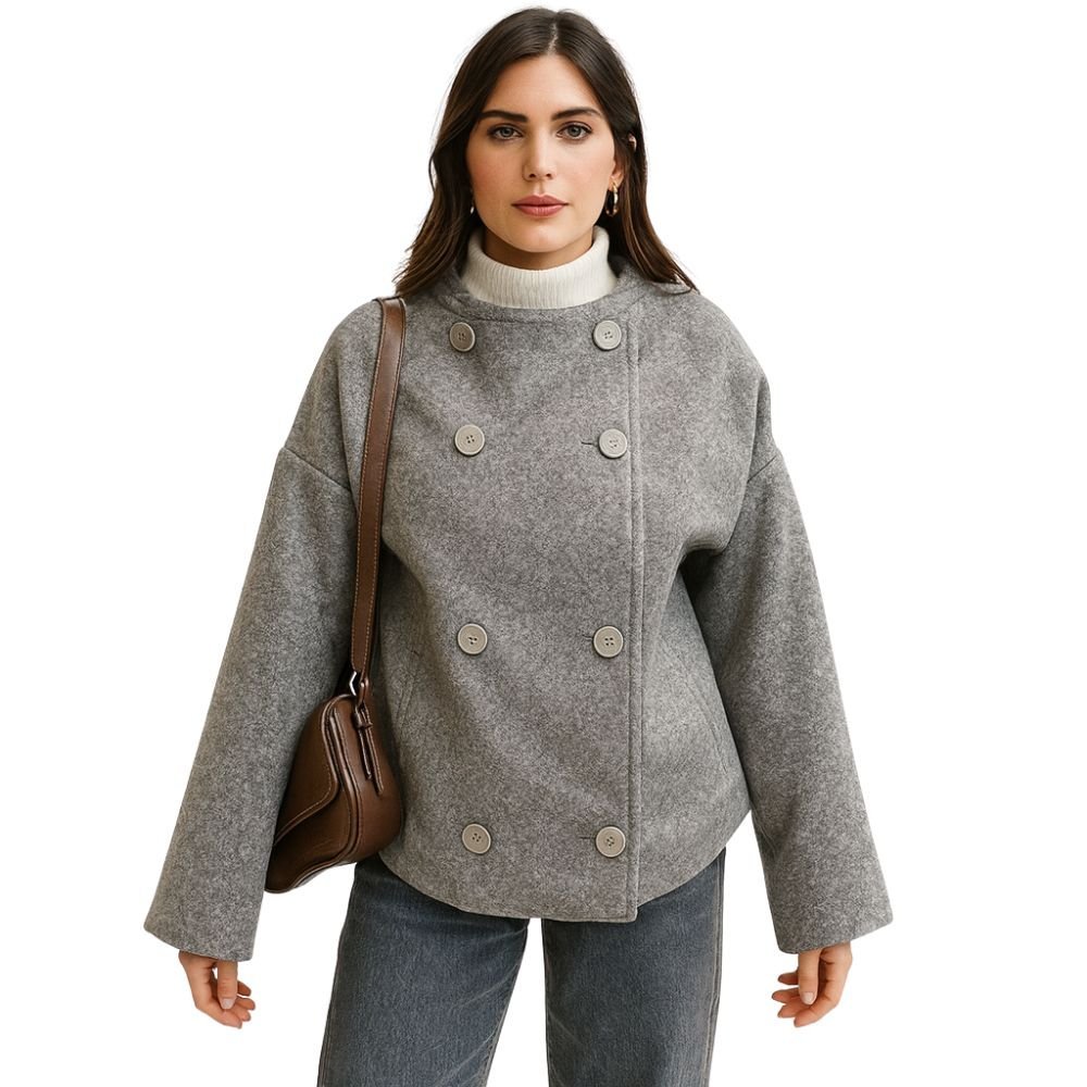 Front view of a model in the Kouvr grey heather cropped wool pea coat, showcasing the jacket's texture and double-breasted design.