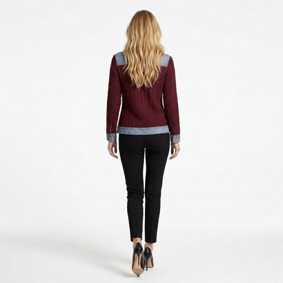 Back view of the Kouvr burgundy sweater highlighting the intricate vertical cable knit texture and structured light wash denim shoulder yoke.