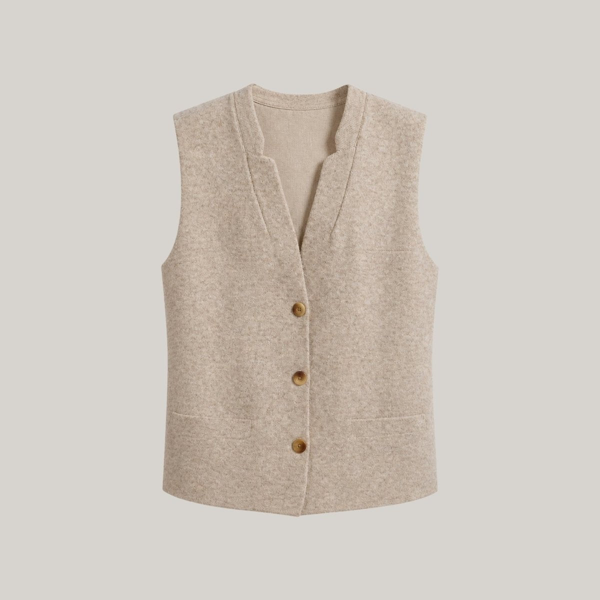 Flat lay product shot of Kouvr oatmeal beige v-neck button-up sweater vest with front welt pockets and faux-horn buttons.