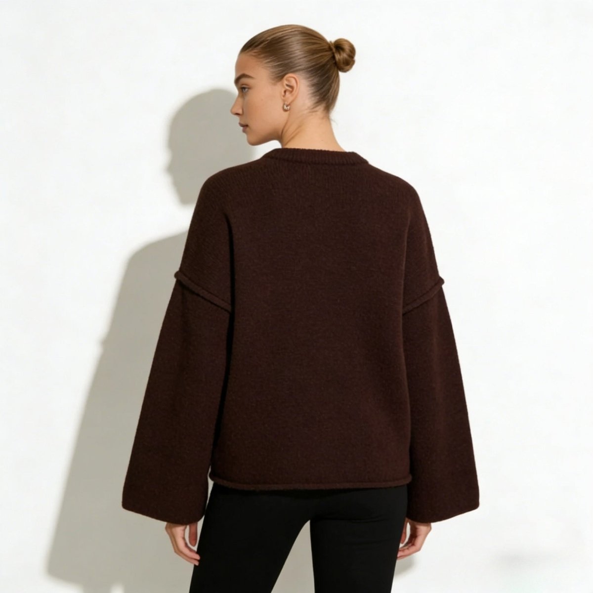 Back view of the Kouvr oversized boiled wool sweater showing its boxy fit.