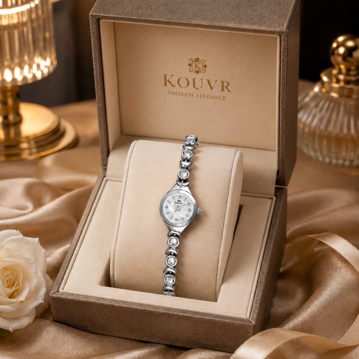 Kouvr elegant women's silver crystal dress watch with mother of pearl dial in a luxury gift box.