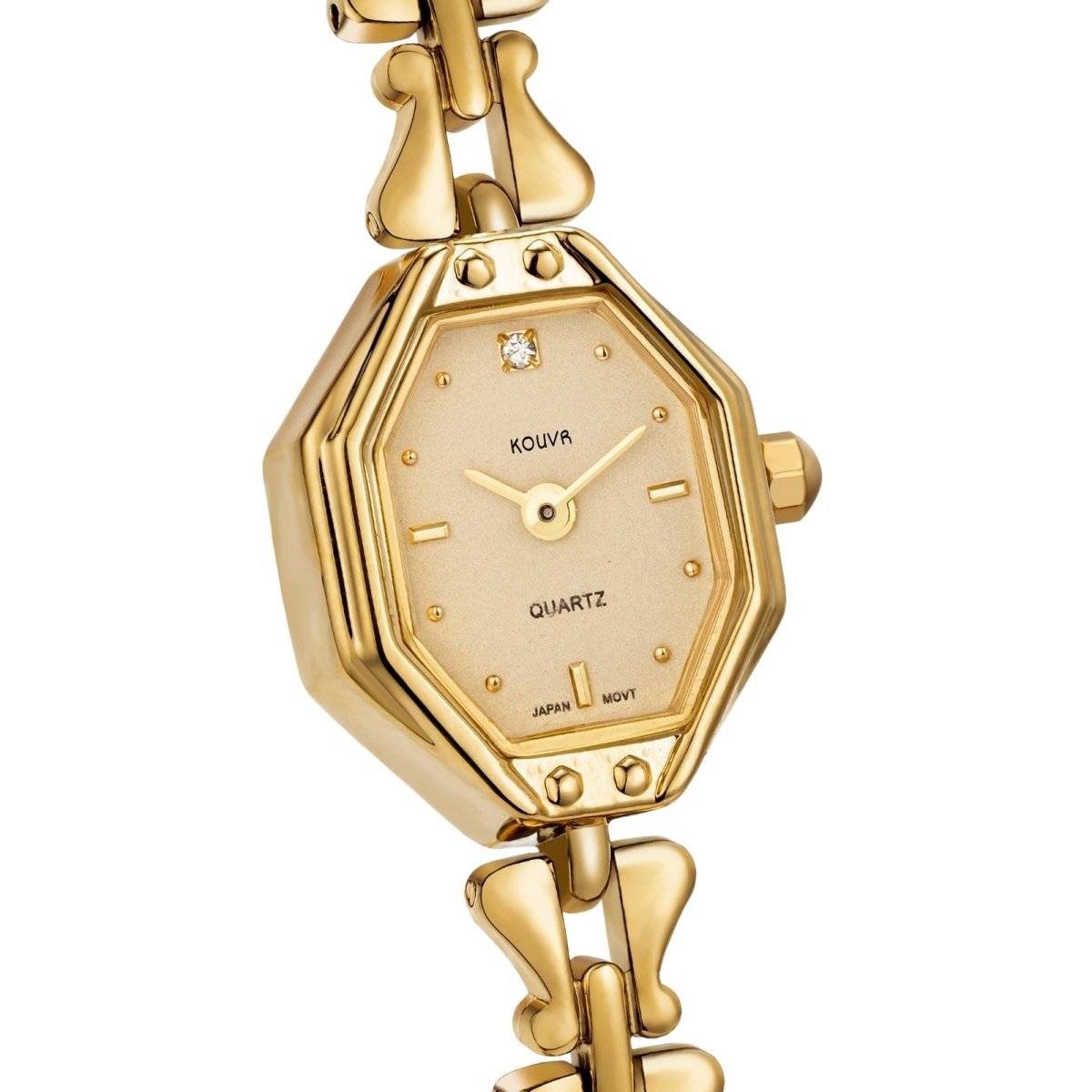 Gold kouvr watch with a diamond on a white background