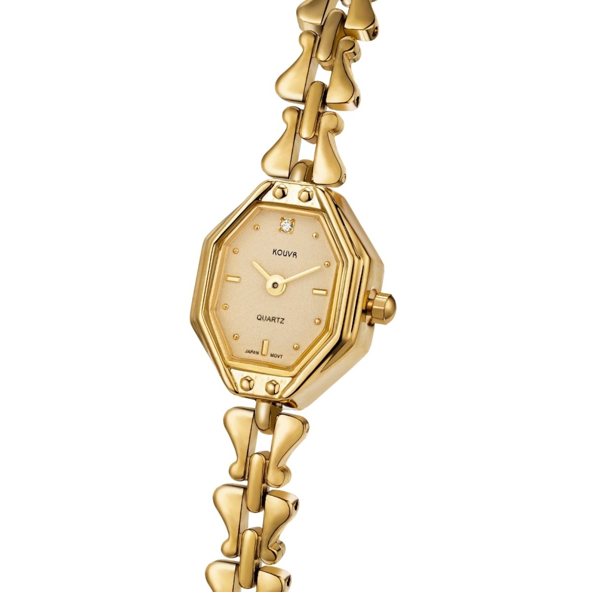 Gold kouvr watch with a decorative band on a white background