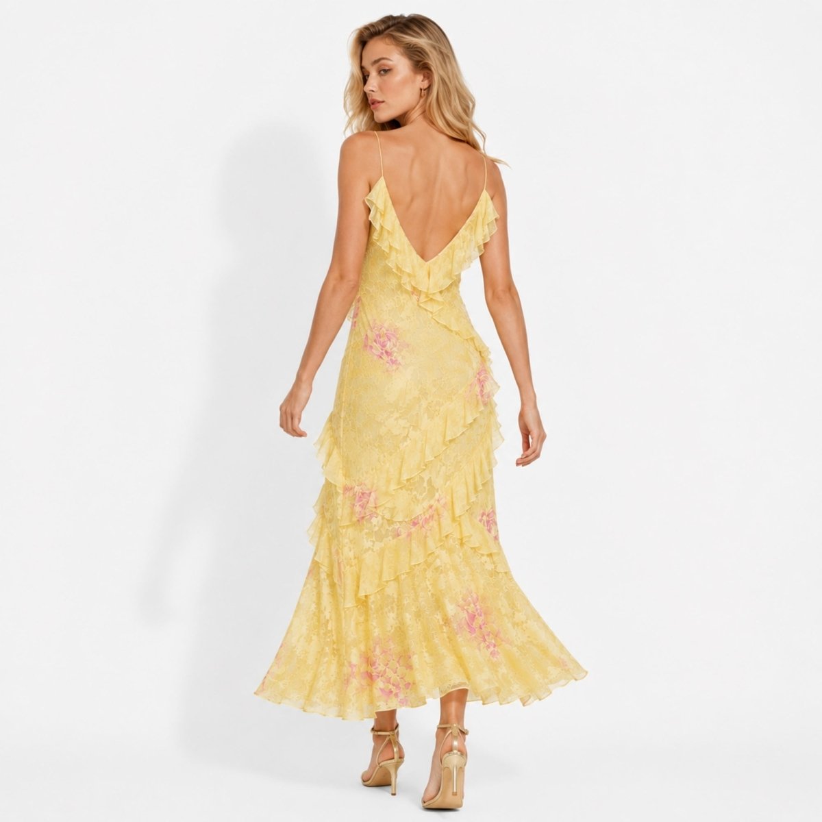 Back view of Kouvr yellow floral gown showing deep v-back and delicate spaghetti straps