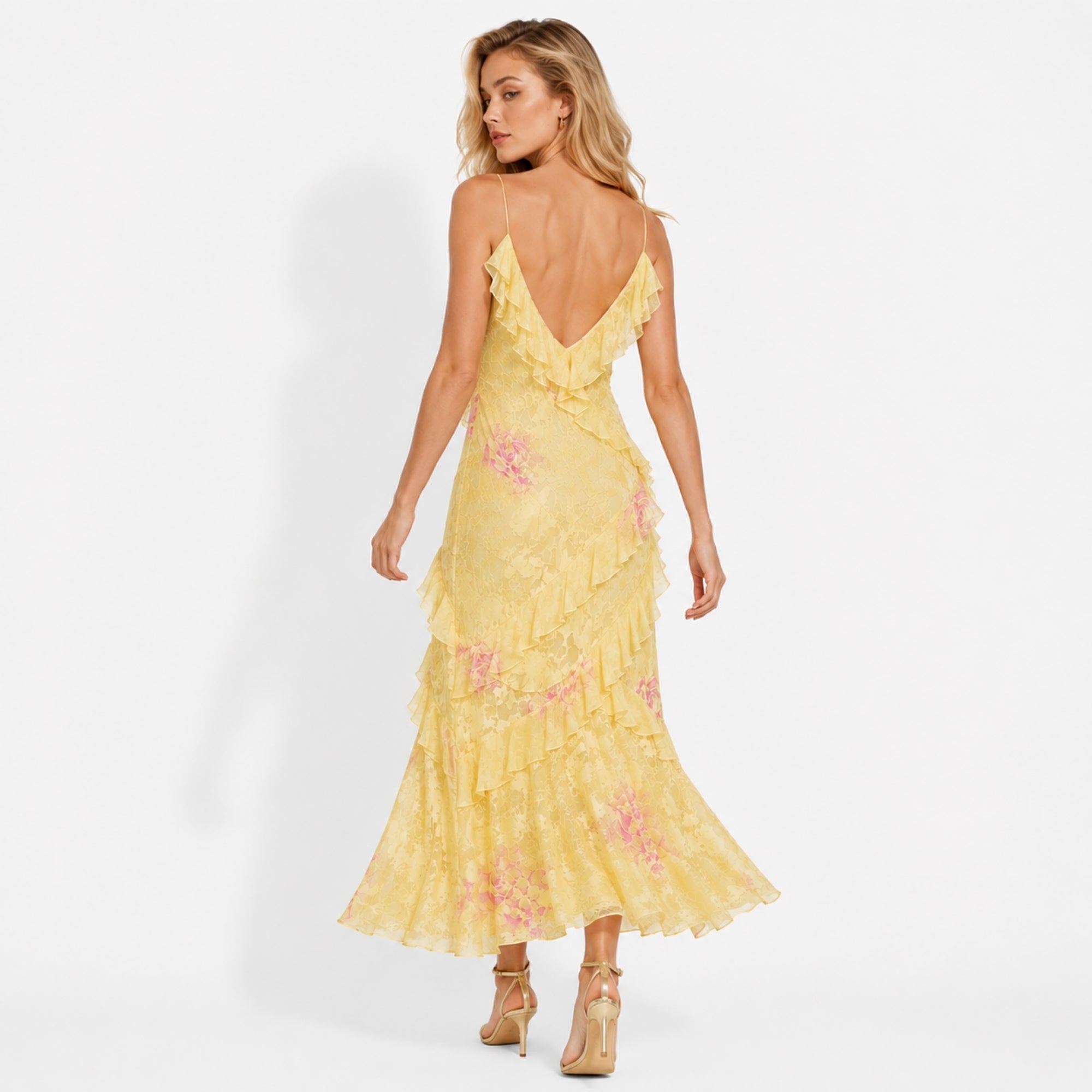 Back view of Kouvr yellow floral gown showing deep v-back and delicate spaghetti straps