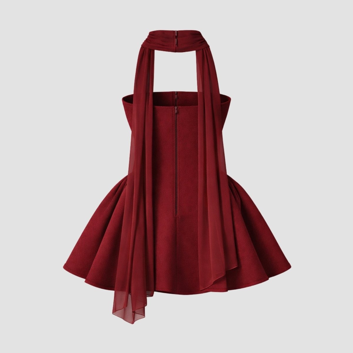 Back product shot of the Kouvr Zelda Burgundy mini dress on a ghost mannequin, showing the zipper closure and draping of the chiffon scarf.