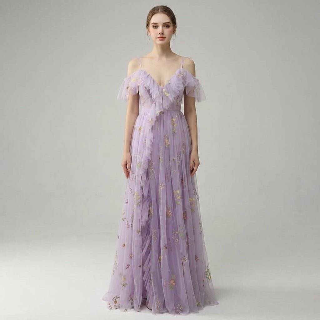 Front view of the Kouvr lavender floral embroidered tulle maxi dress featuring romantic off-the-shoulder ruffles and a flattering V-neckline.