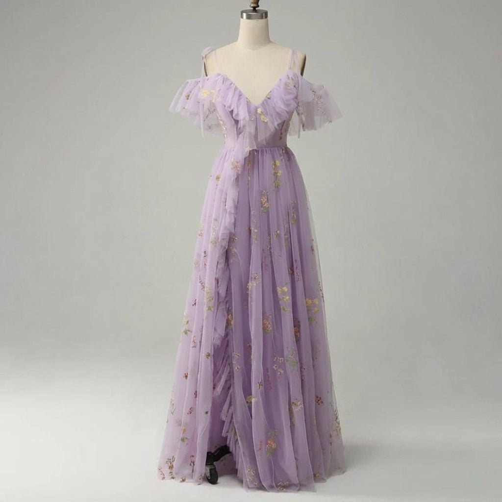 Full length mannequin display of the A-line lavender tulle wedding guest maxi dress showcasing the cascading front slit ruffles.