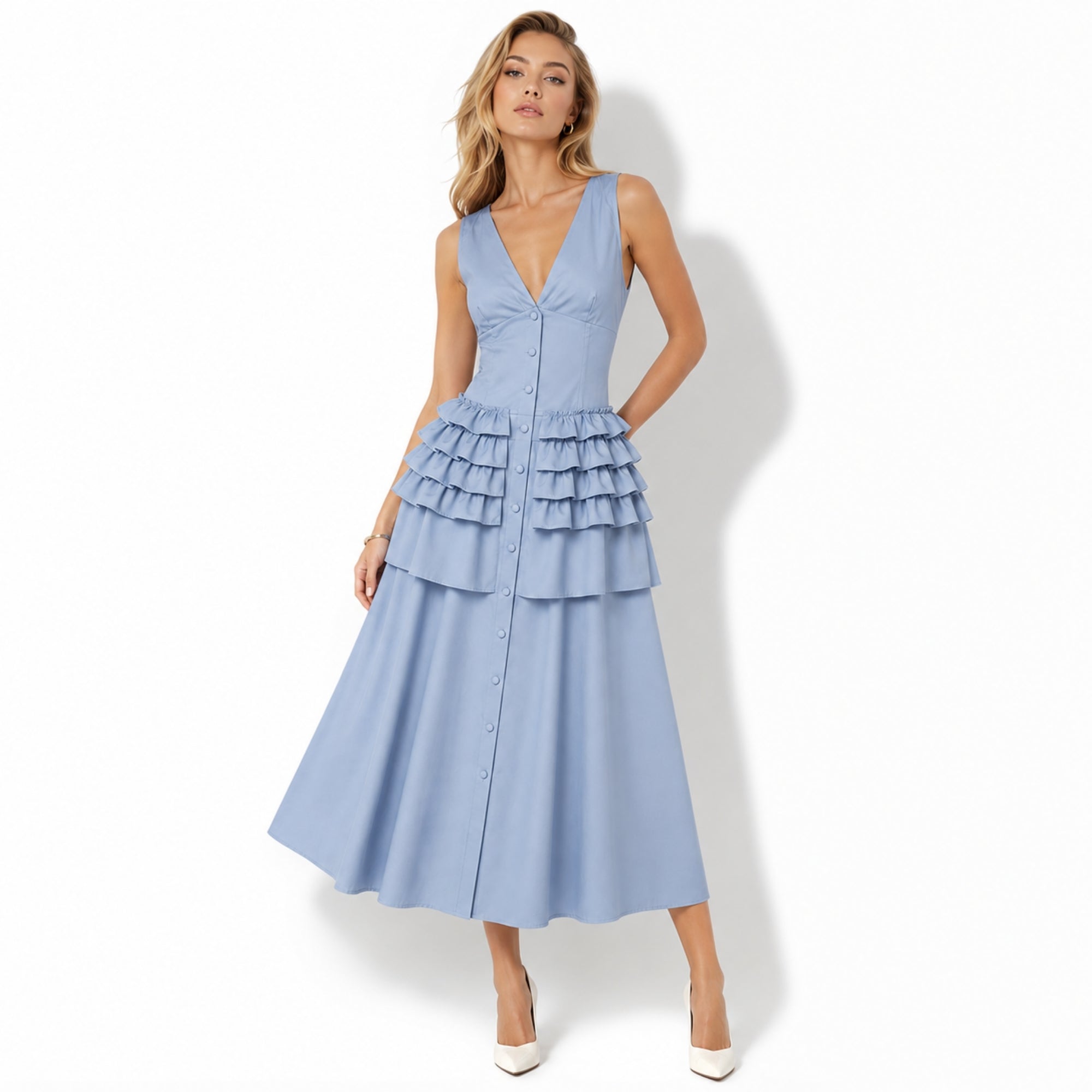 Product laydown of Kouvr light blue sleeveless tiered ruffle midi dress showing structural stitching and premium fabric details.