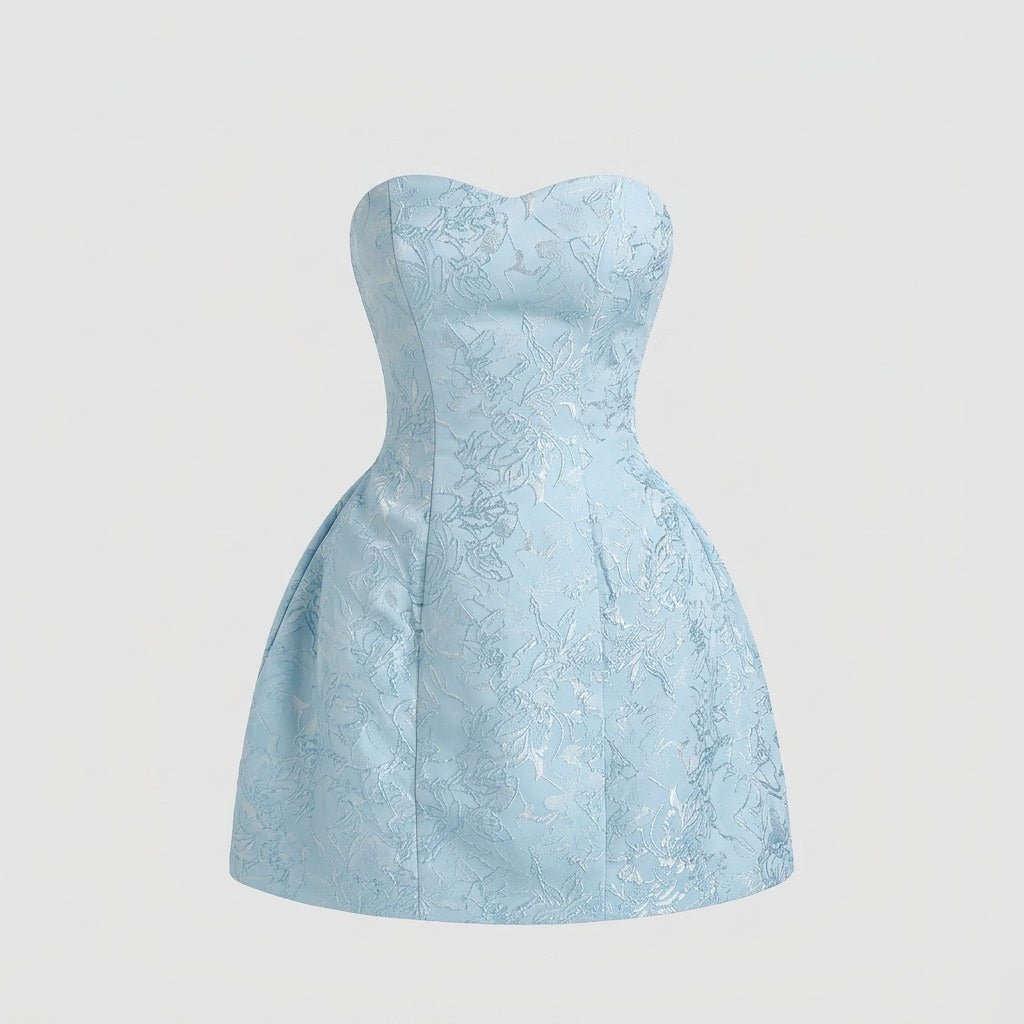 Flat lay front view of the light blue strapless mini dress showing the tailored seams and subtle sweetheart neckline against a grey background.