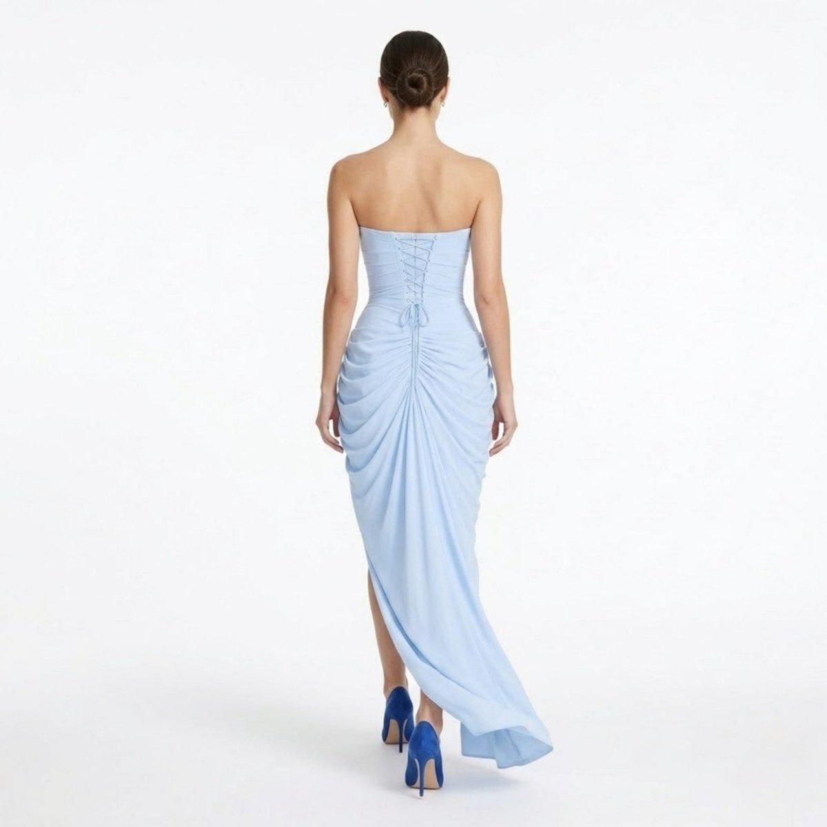 Back view of the Kouvr light blue formal dress highlighting the adjustable corset lace-up back detail and sweeping maxi train.
