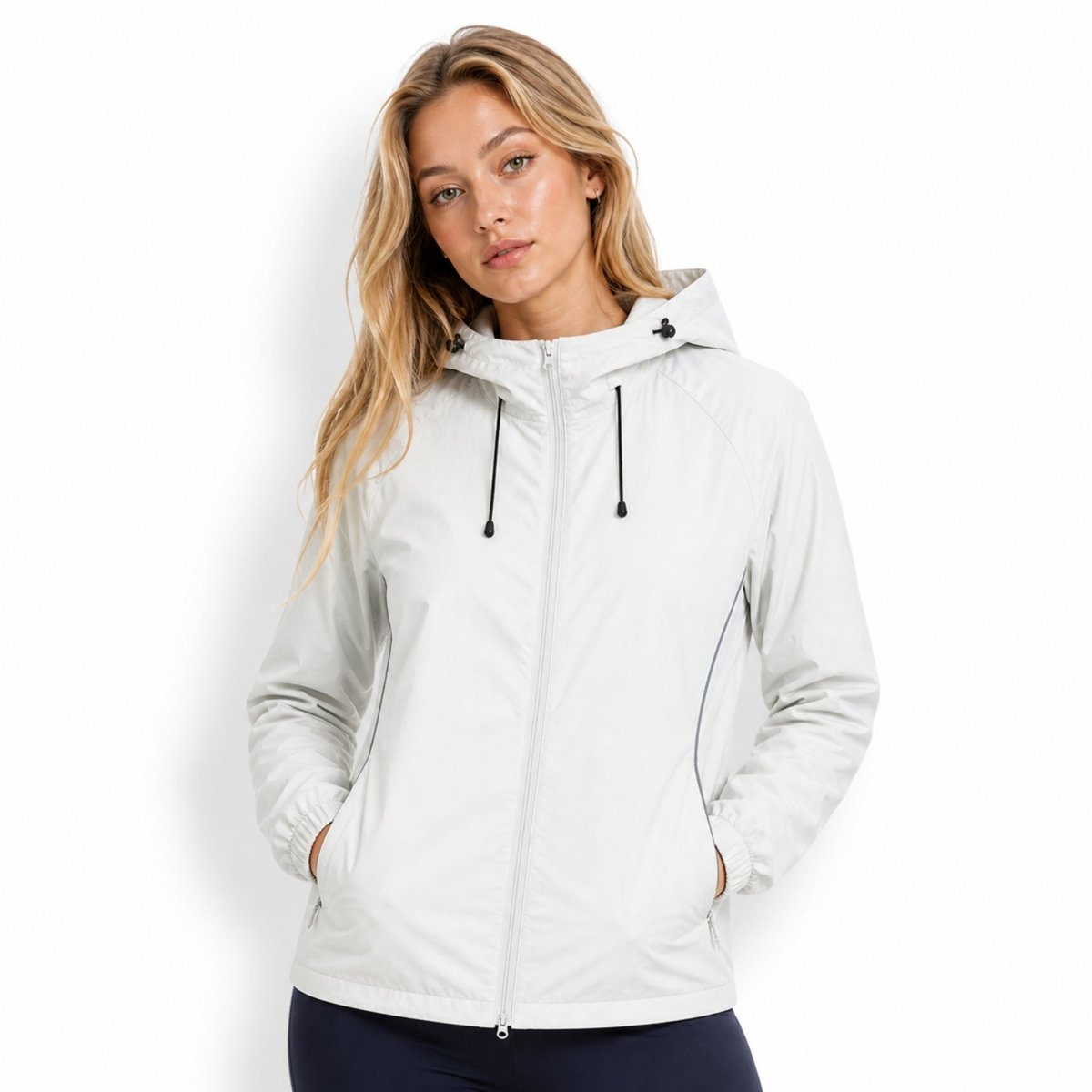 Female model wearing an affordable luxury light grey zip-up windbreaker jacket, showcasing a relaxed fit and versatile styling.