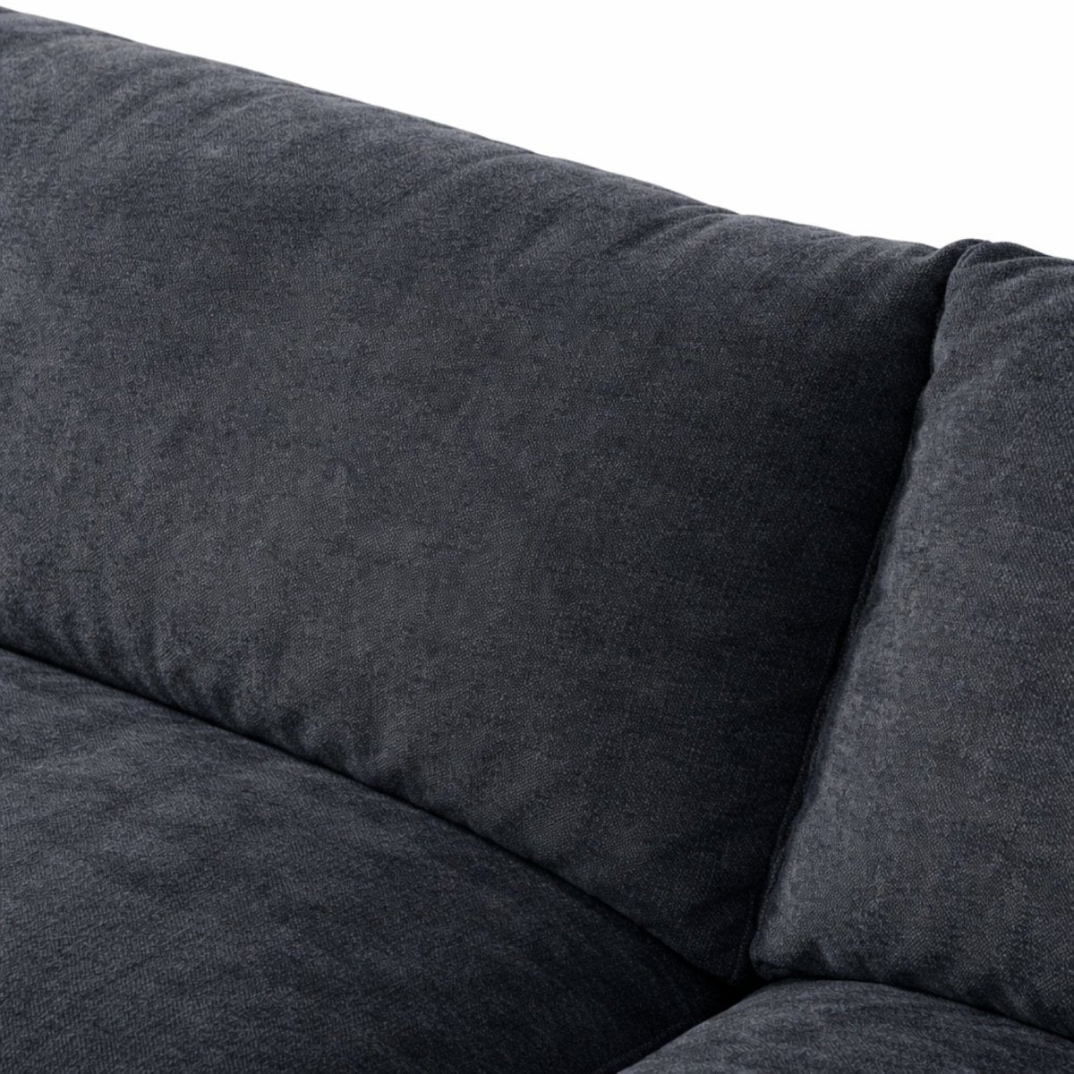 Luxurious dark grey couch fabric and thick back pillow seam details